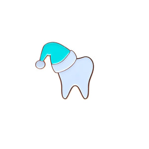 
            
                Load image into Gallery viewer, Specialty Tooth Pin - White Santa in Turquoise Hat
            
        